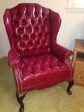 Red arm chair with nailhead trim