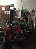 Smokers, grills, barbeque, step ladder, lawn/yard tools, a water fountain, fire extinguisher and even the door in the background