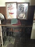 Antique singer sewing machine in perfect condition selling online for $500 - yours for $75 ... atop it sits some cool vintage beer signs