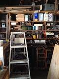 Sander, workbench, mitasaw, drill, shop lights, tools, shear blades, power cords, ladder, vintage tools, oil can, fan, wood, scrap metal, nails, screwdriver set, antique levels, antique stanley planes, electric drill, hacksaw, socket wrench, allen wrench, Combination Square, utility knife, Crosscut Saw, Wood glue, plumber's putty, dust mask, voltage tester, wheelbarrow, shovel, rake, step ladder