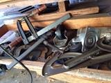 Sander, workbench, mitasaw, drill, shop lights, tools, shear blades, power cords, ladder, vintage tools, oil can, fan, wood, scrap metal, nails, screwdriver set, antique levels, antique stanley planes, electric drill, hacksaw, socket wrench, allen wrench, Combination Square, utility knife, Crosscut Saw, Wood glue, plumber's putty, dust mask, voltage tester, wheelbarrow, shovel, rake, step ladder, metal claps