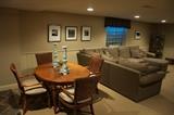 Baker dining room table with two leaves for sale along with four Baker wicker chairs.