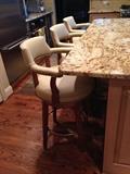 Custom leather bar stools with nail head trim; custom ordered from Gorman's furniture; barely used