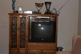 Entertainment center with tv and home decor
