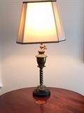 Antique brass lamp with cream-colored silk shade