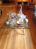 Steel and brass hooved foot glass top table, crystal decanters, large Lladro flamenco dancers figural group