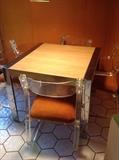 Set of four 70's Modern lucite and steel chairs, chrome and formica table