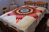 Stunning quilt on maple bed