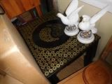 One of two lacquered tables made with Korean coins 