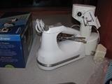 Kitchen Aid hand mixer.  Also a Kitchen Aid meat grinder attachment