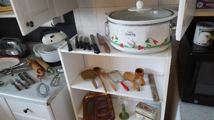 Mixture of old and new -- crock pot, modern knives, but also lots of vintage kitchen implements.