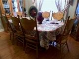Large Dining table, oak with 8 chairs. China Cabinet matches