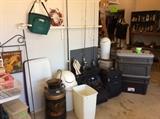 Garage - vintage large milk can, wastebaskets, luggage of various sizes, ice chests, fishing poles with reel, 1 crappie pole