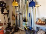 Garage - trolling motor, mops, brooms, blowers etc