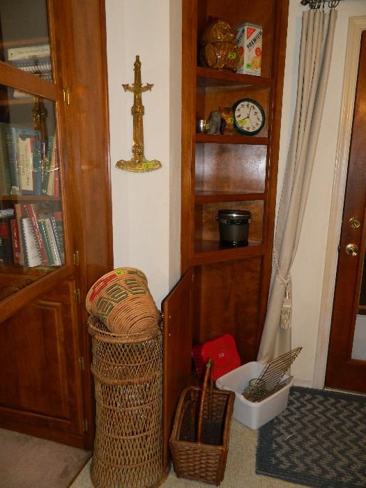 Baskets, collectibles on wall and inside cabinet