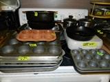 Baking sheets, muffin pans, iron skillet, casserole carrier with pyrex dish, pots, bake ware
