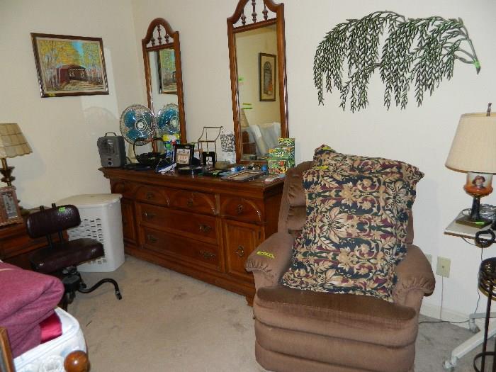 Chest, vintage office chair, fans, miscellaneous items on dresser