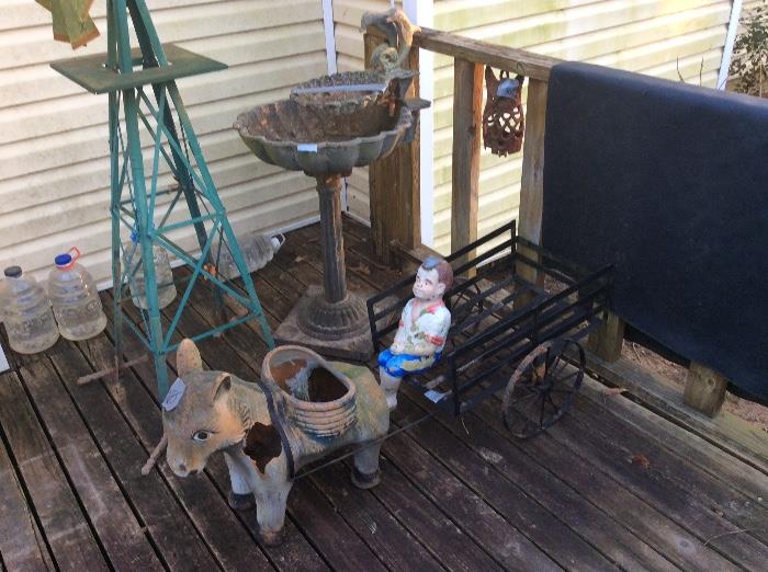 Statuary Donkey with attached wagon (metal), boy in wagon is separate.  Windmill and bird bath along with Owl hanging between the posts