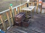 Old milk crates, rain guage, table