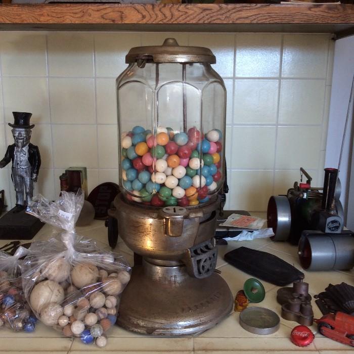 Gumball machine, one of two, variety of old toys