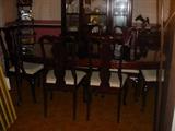 Beautiful dining room table, with two leaves, full table pads, 8 chairs, china cabinet, and folding top serving hutch as well.