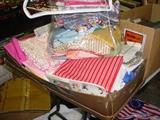 Boxes and tubs of vintage fabric, linens, and supplies
