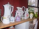 Unique porcelain pitchers, vases, bells,, and color glass vases