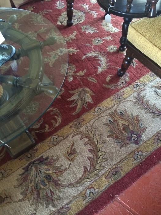 One of several rugs; boat steering wheel table with glass top