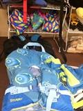 Lots of children's life jackets