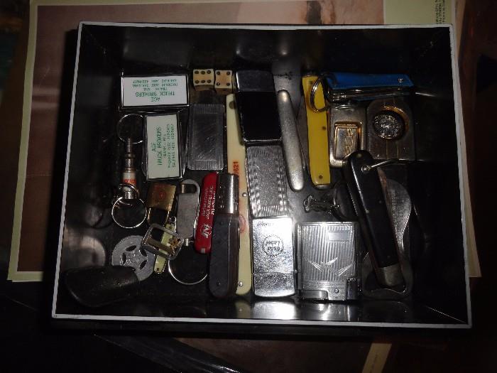 old pocket knives lighters, dice, money clips