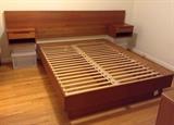 Queen size teak platform bed with headboard & attached nightstands - works with a standard queen mattress.  Made in Denmark by Torring Mobelfabrik.  Dimensions:  102" wide, 82" long.  Nightstands are 17" deep.  (Plastic bins are only there to hold up the headboard for photo)
