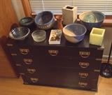 Asian-inspired black chest with brass hardware, more studio pottery including nesting bowls by Oregon potter Hiroshi Ogawa, glass fishing float, flower frogs