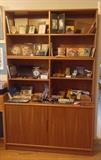 Large teak cabinet - made in Denmark. It's actually 3 separate pieces.  Lower part is a 2-door cabinet, upper part is 2 (horizontal) bookshelves.  Pieces sold separately - buy one or all. Other fun stuff includes art supplies: colored pens & pencils, markers, watercolors, brushes, drawing tools, etc., frames, postcard sets & more