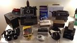 Empire binoculars, No. 2-A Brownie camera, Polaroid 440 Automatic Land Camera + Polaroid film, several Sony Walkmans, Signet TK22 headphones, Grundig FR200 Emergency crank radio with original box, Discwasher record cleaner, Polaroid SX-70 Land Camera Alpha 1, Model 2