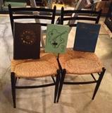Pair of black rush seat chairs, plus vintage 1950's yearbooks from Oregon & Hawaii
