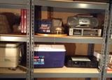 Igloo & Rubbermaid coolers in good condition, Sony boombox (radio/CD/tape player), Sony TC-FX600 stereo cassette deck, Yamaha K-420 stereo cassette deck.  The big metal shelves are for sale too!