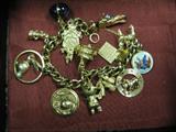 14k Gold Charm Bracelet, with both Gold and Gold Filled Charms, appears to weigh approx close to 2 oz troy,