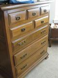 Light Mahogany Dresser, also in the sale is a King Size Bed Frame, Brazier Style End Tables, and a Nightstand.