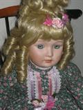One of Several Goebel Porcelain Dolls and Chairs