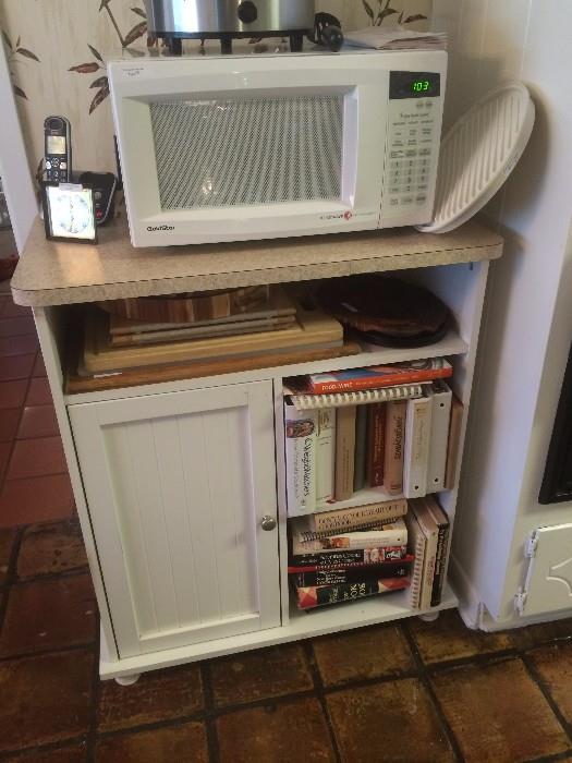 Microwave, cart, and cookbooks