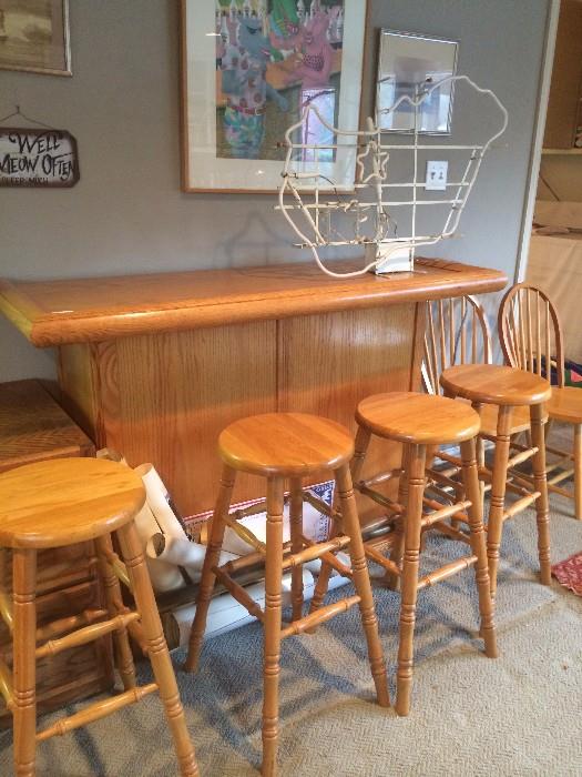 Bar with 4 stools; neon sign of Hungary