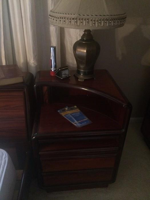 One of the two matching nightstands