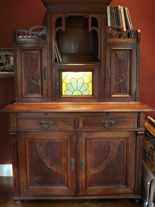 Art Nouveau cabinet with original key, 2 draws, 6 cabinets, back lite stain glass cabinet. statement piece $1700 OBO Moving would love to go to a new caring home. This has been a family heirloom for many years.