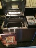 Stainless William Sonoma bread maker with recipe book & instructions, used once. Great working order and pristine condition. $125.

