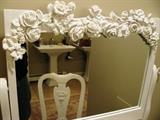 Shabby chic vanity with ornate flower mirror