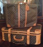Louis Vuitton: SIRIUS 55 SUITCASE - LV MONOGRAM CANVAS TRAVEL BAG (shown on top 21'x19'x7'); Stratos 80 Suitcase w/Buckles (shown on bottom 27"x18"x9")