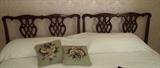 Two antique twin headboards combined as king