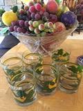 Punchbowl, artificial fruit and glasses