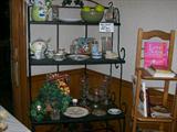 Bakers rack, cookbooks, teapots and vases