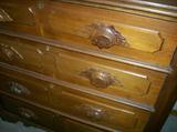 Close-up shot showing the Hand Carved pulls.